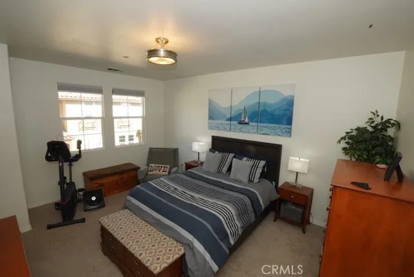 a bedroom with a bed and a couch