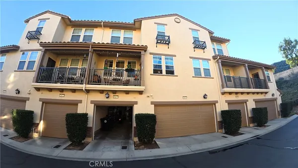 a front view of a building with many windows