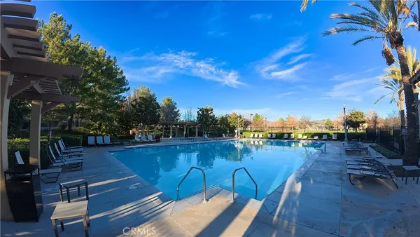 a view of a lake with couches in patio