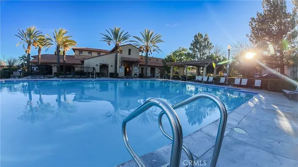 a view of a swimming pool with a lounge chair