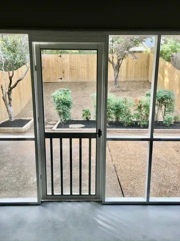 a view of backyard with green space