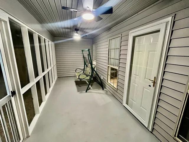 a view of a hallway with stairs