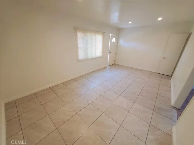 a bedroom with a bed and a window in it