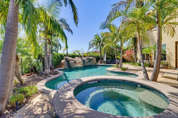 a view of swimming pool outdoor seating and barbeque oven