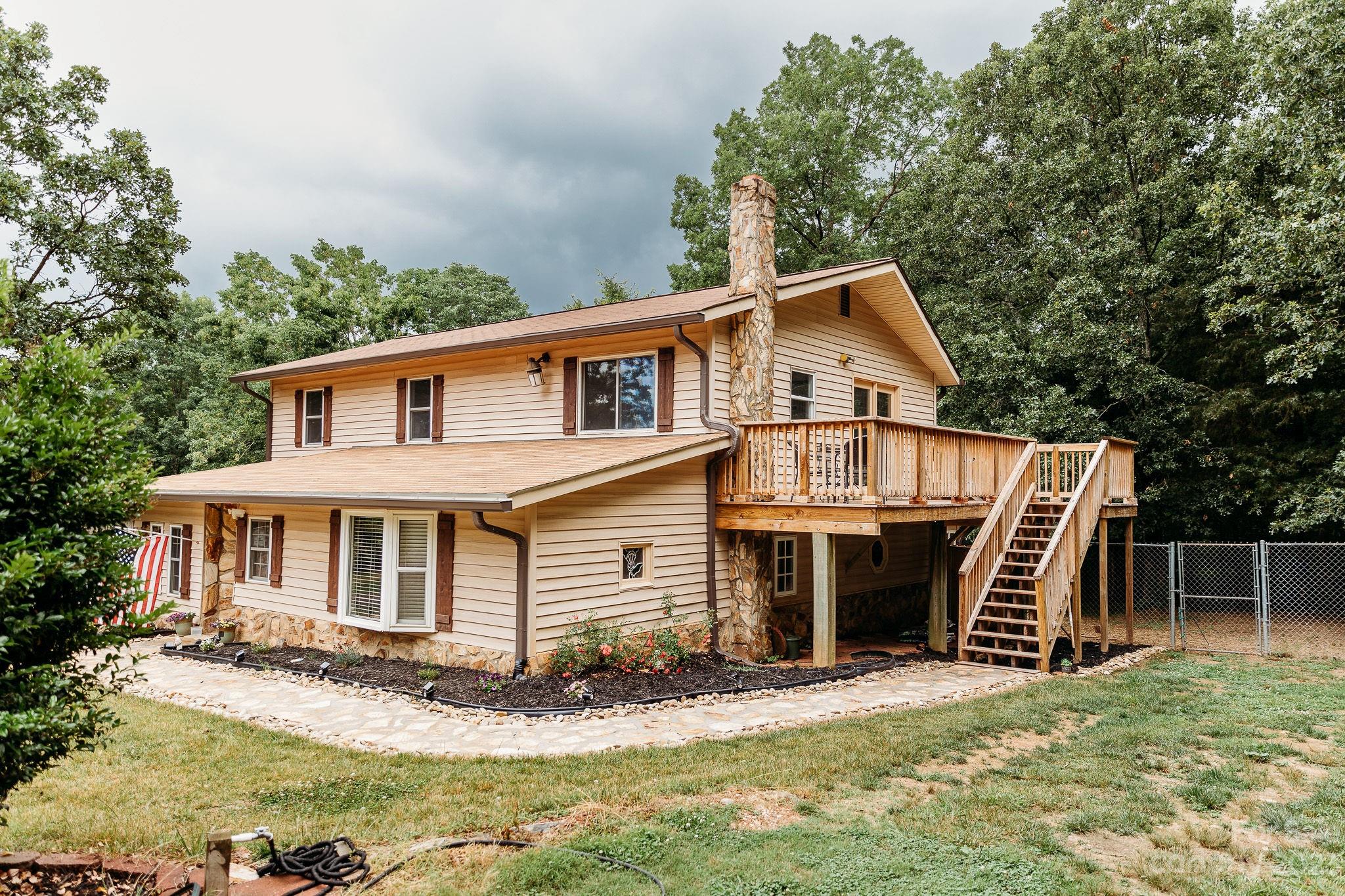 8808 Webb Road Stanfield, NC 28163 - Photo 1 of 33 a front view of a house with a yard