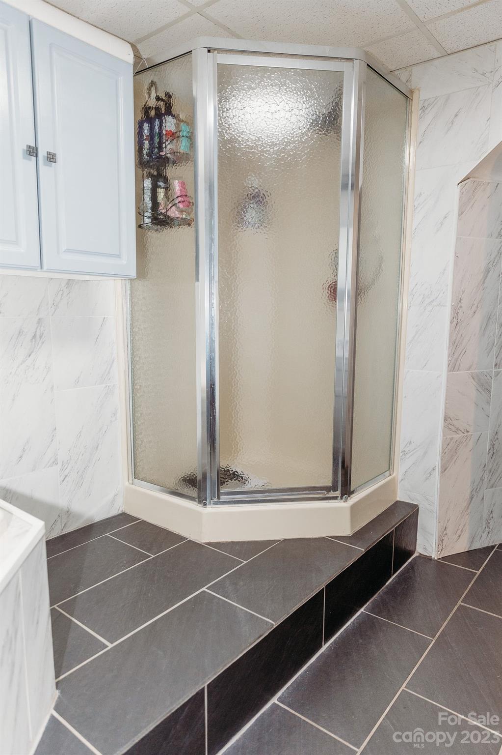 8808 Webb Road Stanfield, NC 28163 - Photo 11 of 33 a bathroom with a shower and a mirror