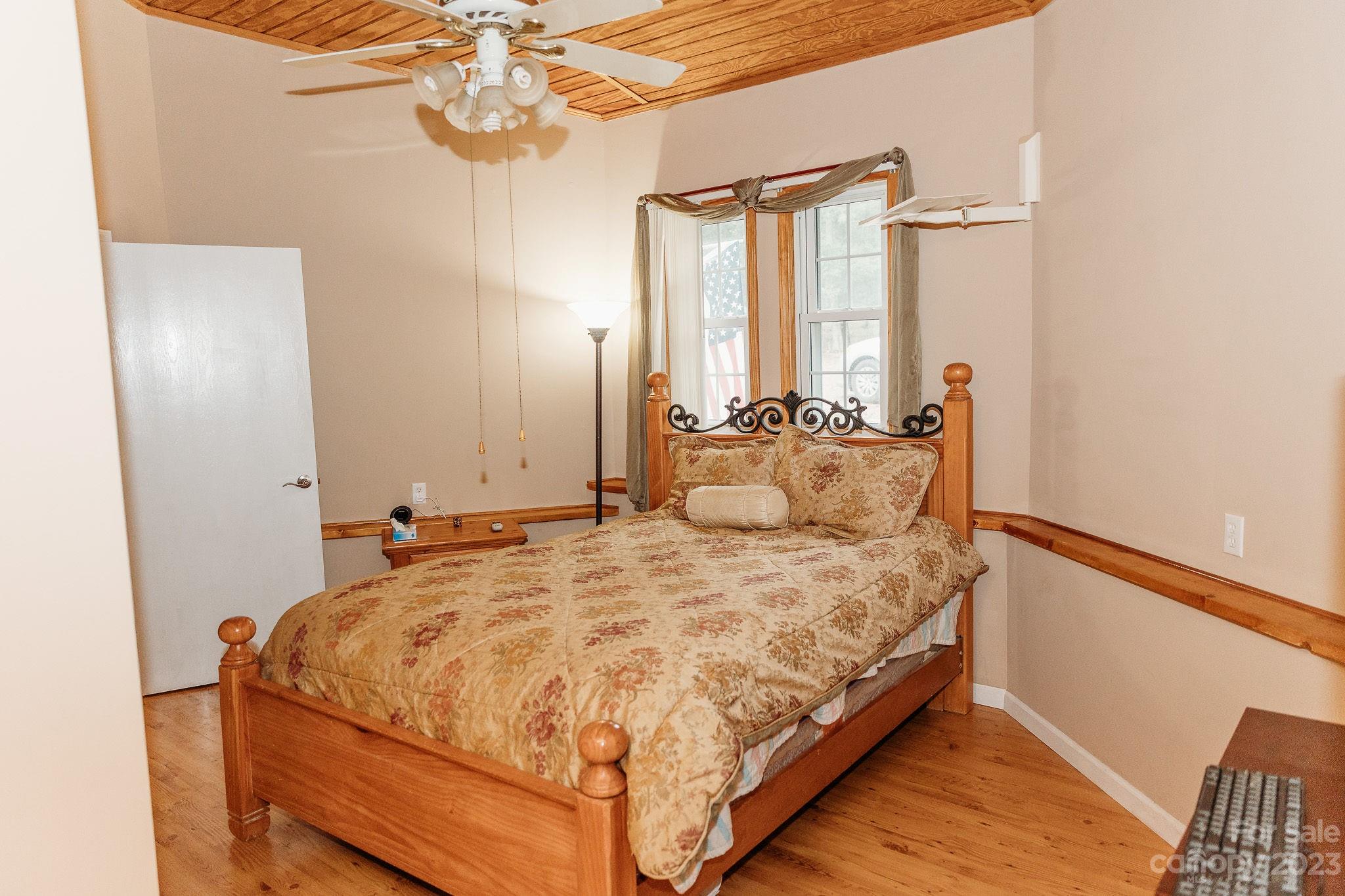 8808 Webb Road Stanfield, NC 28163 - Photo 13 of 33 a bed sitting in a bedroom next to a window