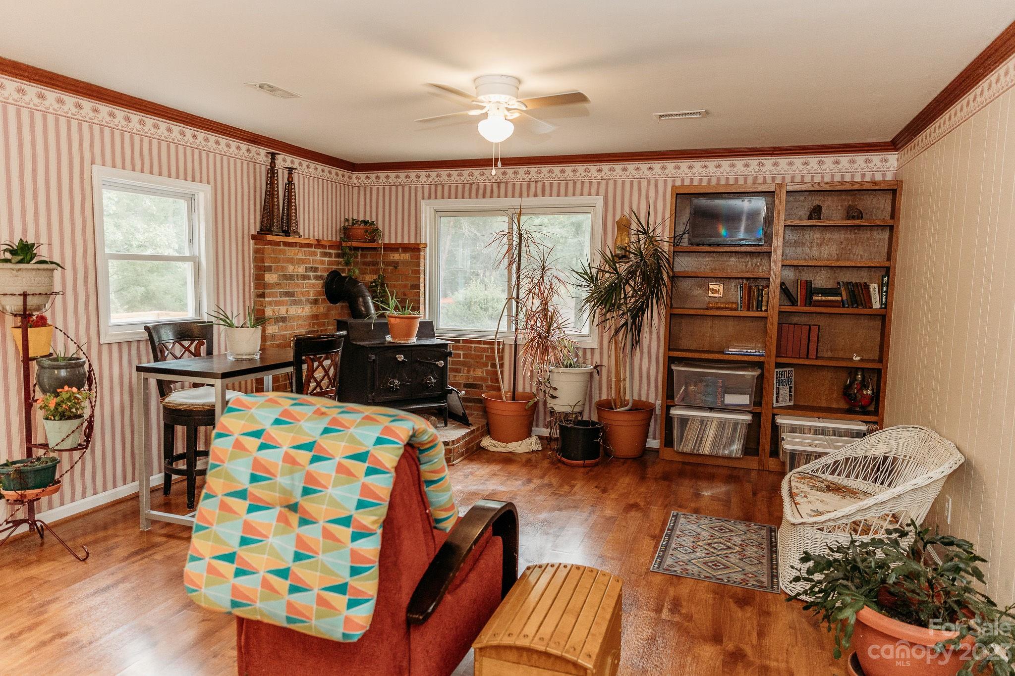 8808 Webb Road Stanfield, NC 28163 - Photo 19 of 33 a living room with furniture and a large window