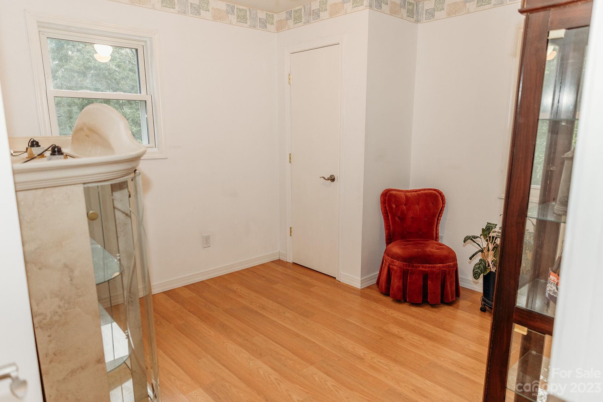 8808 Webb Road Stanfield, NC 28163 - Photo 20 of 33 a bedroom with a bed and wooden floor