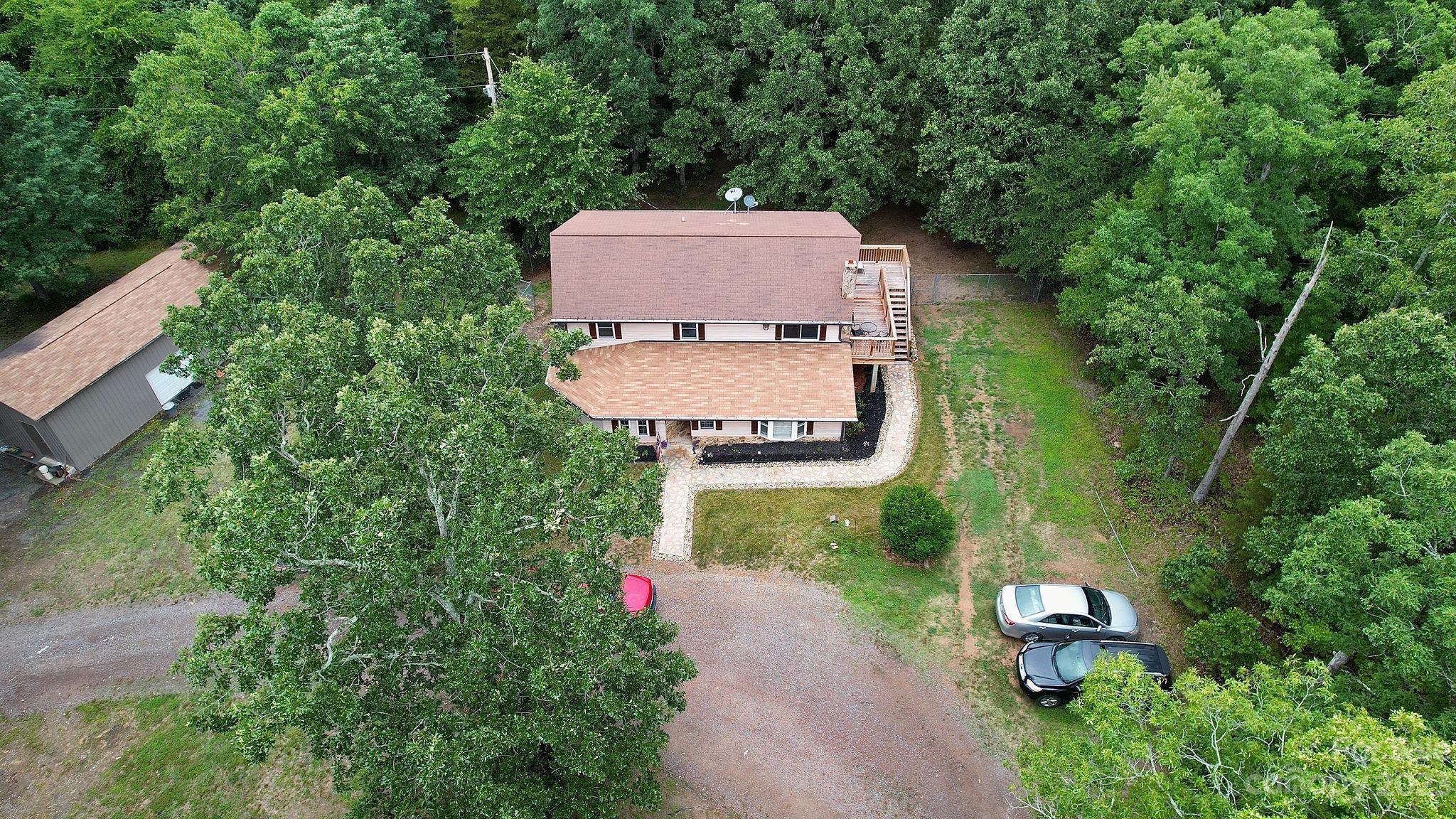 8808 Webb Road Stanfield, NC 28163 - Photo 27 of 33 an aerial view of a house with a yard and lake view
