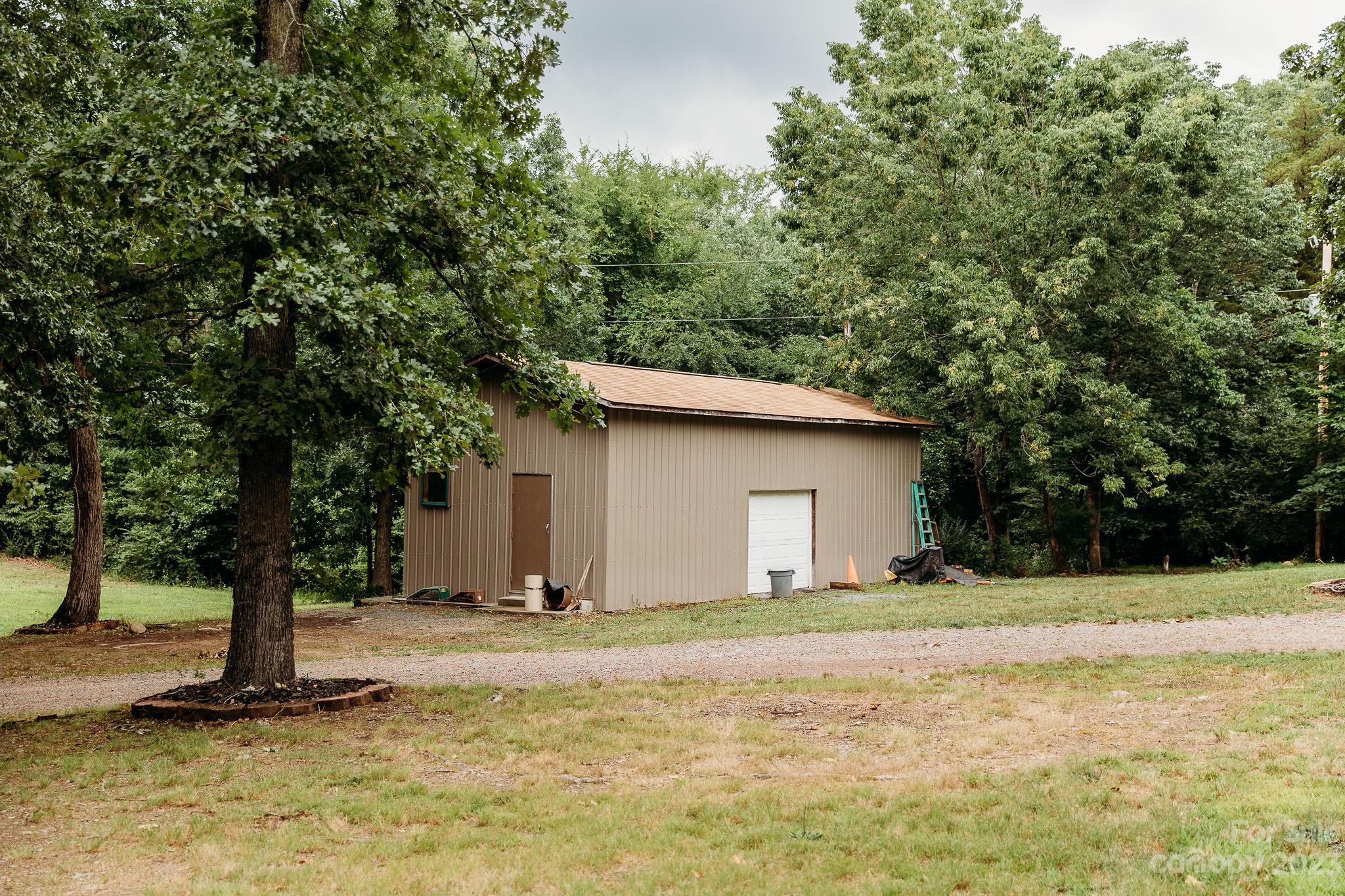 8808 Webb Road Stanfield, NC 28163 - Photo 32 of 33 a backyard of a house with lots of green space