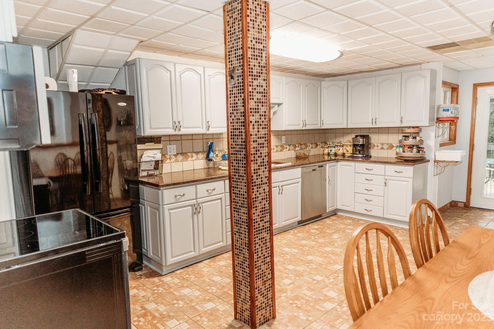 8808 Webb Road Stanfield, NC 28163 - Photo 6 of 33 a kitchen with stainless steel appliances granite countertop a refrigerator and a stove top oven
