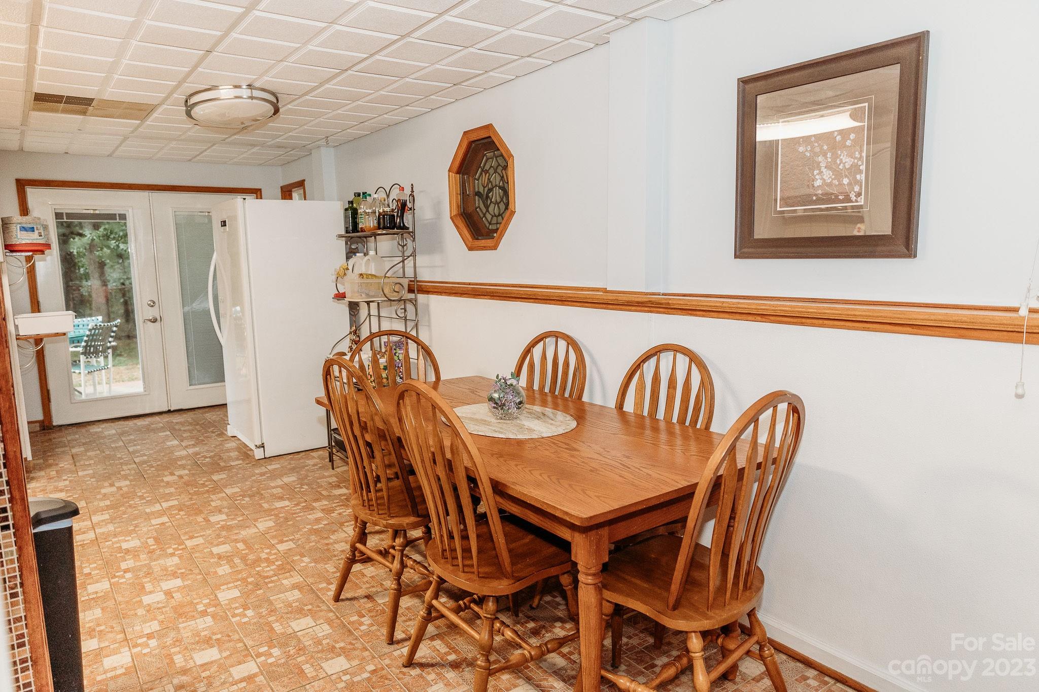 8808 Webb Road Stanfield, NC 28163 - Photo 8 of 33 a view of a dining area with furniture and chandelier