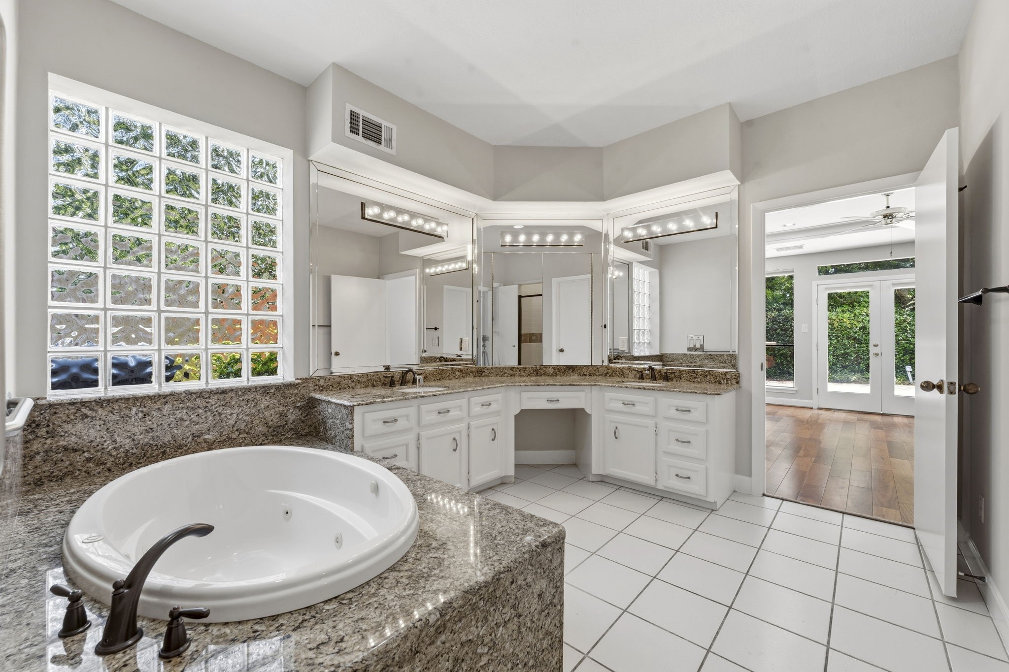 18503 Cabaniss Circle Spring, TX 77379 - Photo 27 of 49 Designed for everyday comfort with separate vanity areas, a dedicated makeup station, and a seamless connection to the primary suite.