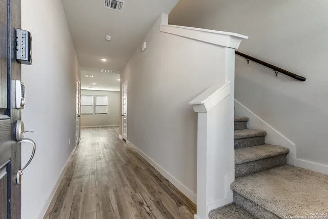 a view of entryway with wooden floor