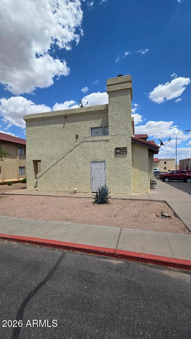 2650 East McKellips Road, Unit 241 Mesa, AZ 85213 - Photo 2 of 2 a view of a parking space with a car parked on the road
