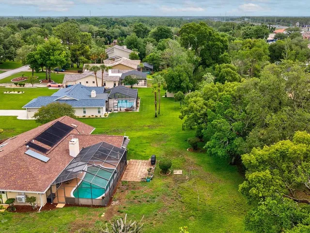 a view of a lake with houses in the background