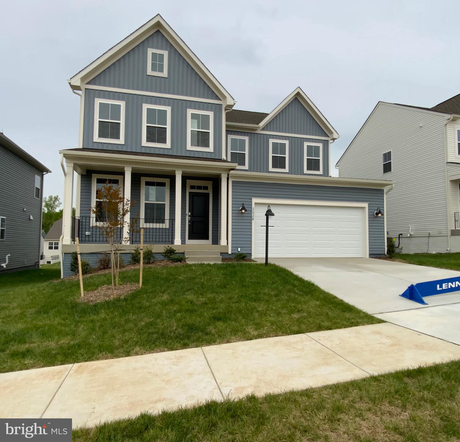 18149 Telford Drive Warrenton, VA 20186 - Photo 1 of 9 a front view of a house with a garden