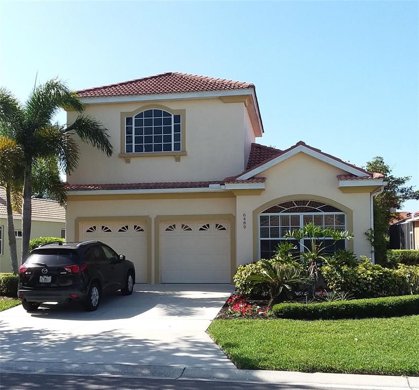 6489 Rookery Circle Bradenton, FL 34203 - Photo 1 of 1 a view of a house with a yard