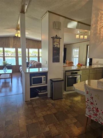 a living room with furniture and flat screen tv