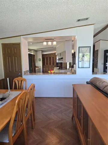 a living room with furniture and a lamp