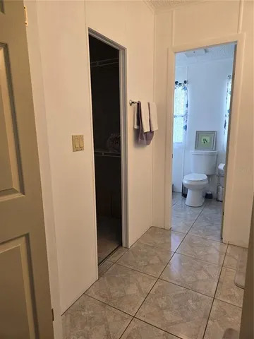 a bathroom with a toilet and shower