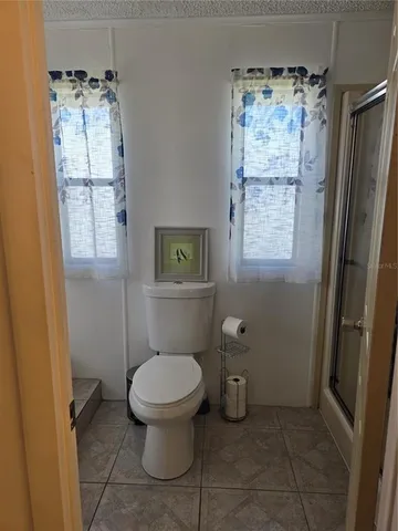 a view of a hallway to a bedroom