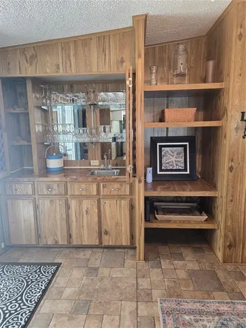 a kitchen with stainless steel appliances granite countertop a sink and cabinets