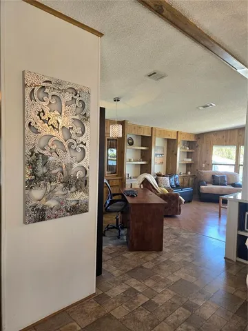 a kitchen with granite countertop a refrigerator a stove a sink and dishwasher