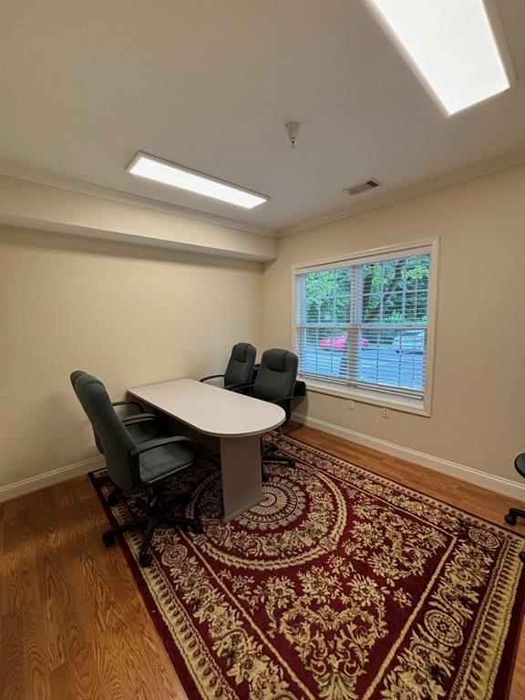 122 Prospect Place Alpharetta, GA 30005 - Photo 2 of 9 a workspace with furniture and a window
