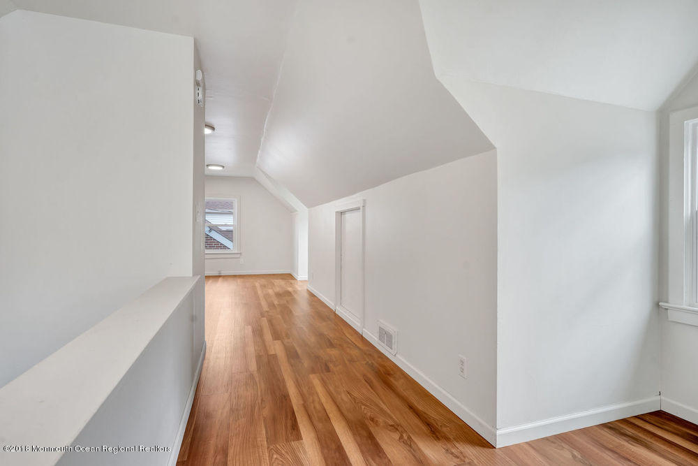 71 Ravine Drive Matawan, NJ 07747 - Photo 14 of 22 a view of hallway with wooden floor
