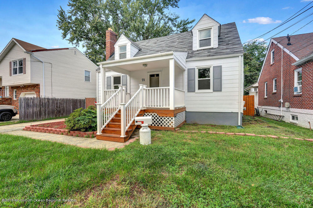 71 Ravine Drive Matawan, NJ 07747 - Photo 21 of 22 a view of a house with a backyard and a chair