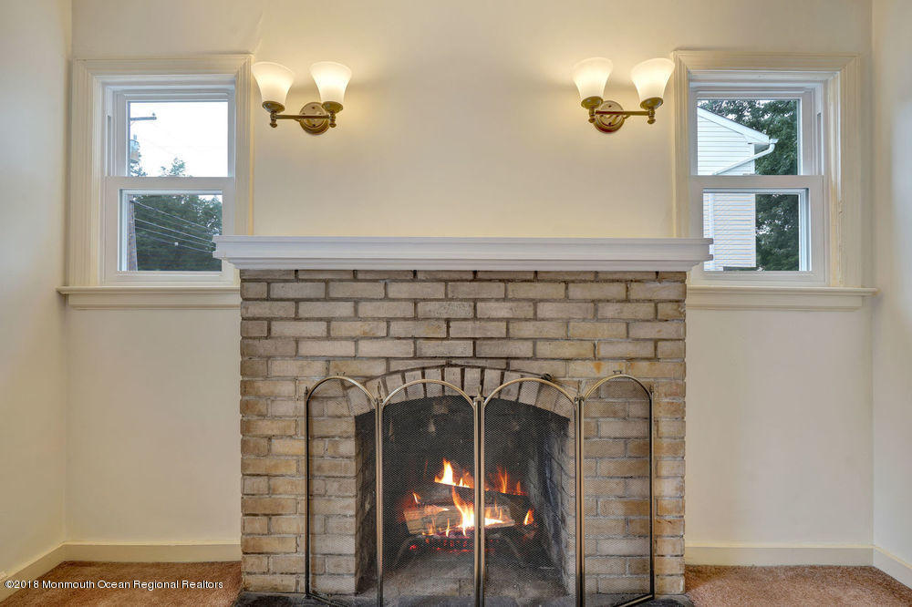 71 Ravine Drive Matawan, NJ 07747 - Photo 7 of 22 a close view of a fireplace in a room