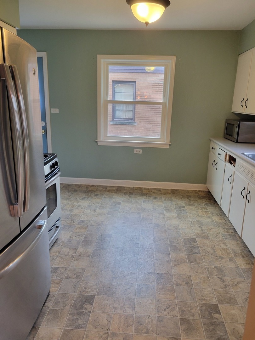 8918 Parkside Avenue Morton Grove, IL 60053 - Photo 16 of 36 a view of room with window and stainless steel appliances
