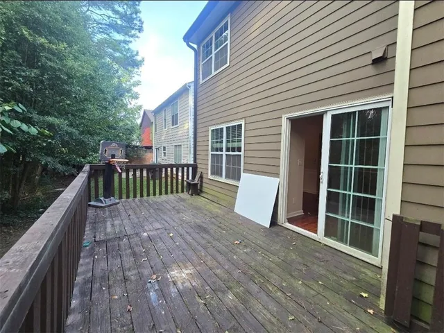 a view of deck with wooden floor and outdoor seating