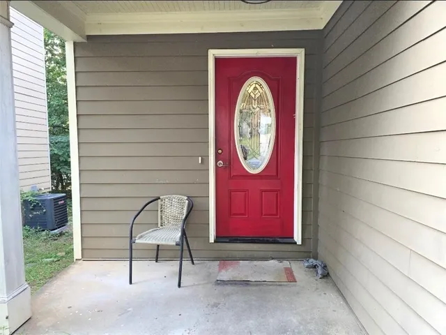 a view of a house with a door and a table