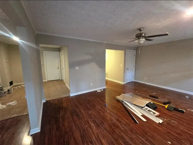 wooden floor in a hall with a window