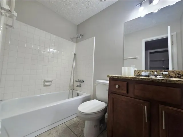 a bathroom with a sink double vanity and a mirror