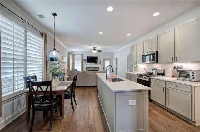 a view of a dining room with furniture window and wooden floor