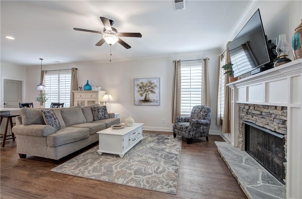 6 Encore Lane Cartersville, GA 30120 - Photo 10 of 33 a living room with furniture a window and a fireplace