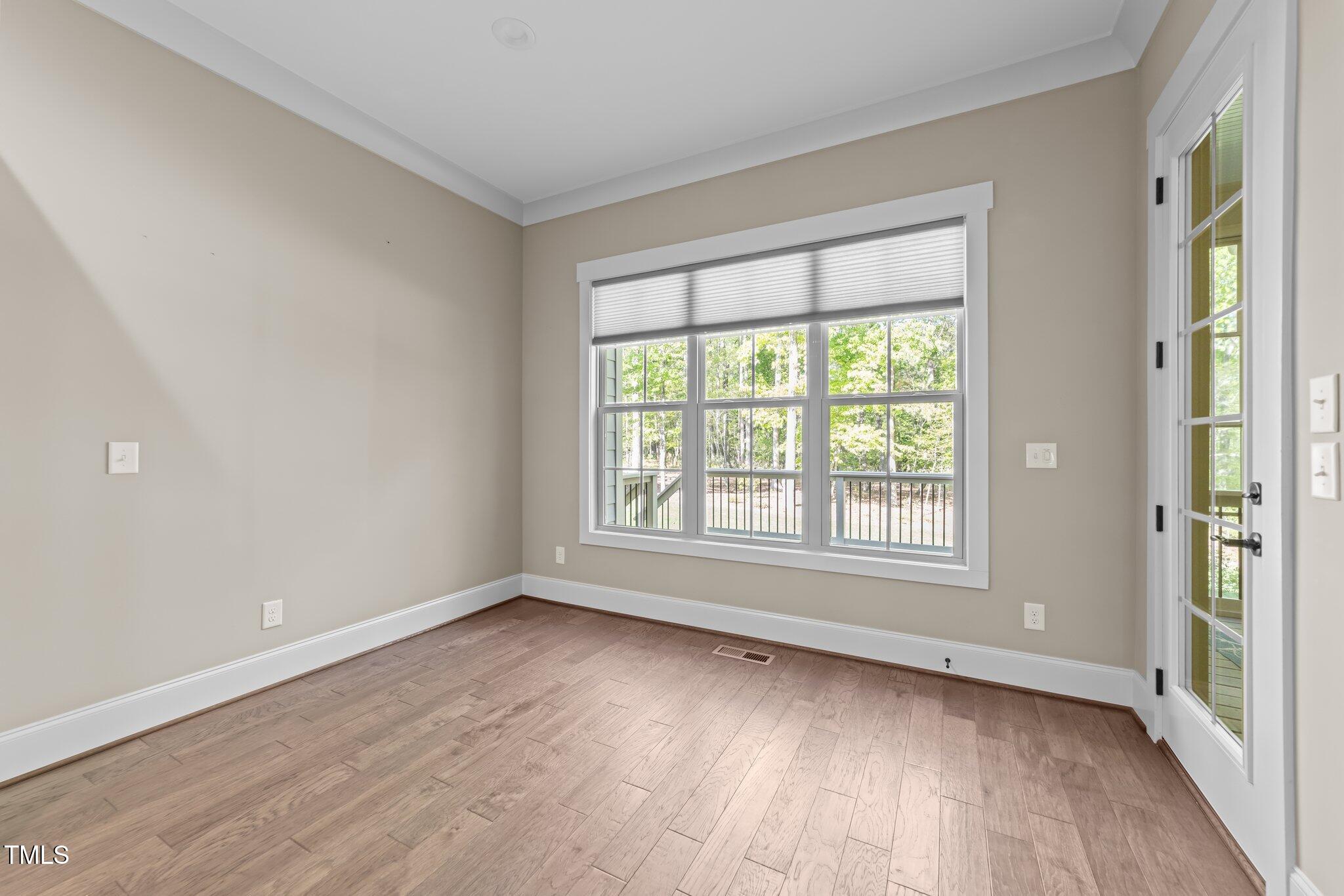 4924 Theys Road Raleigh, NC 27606 - Photo 25 of 74 Dining nook leads to screened in room