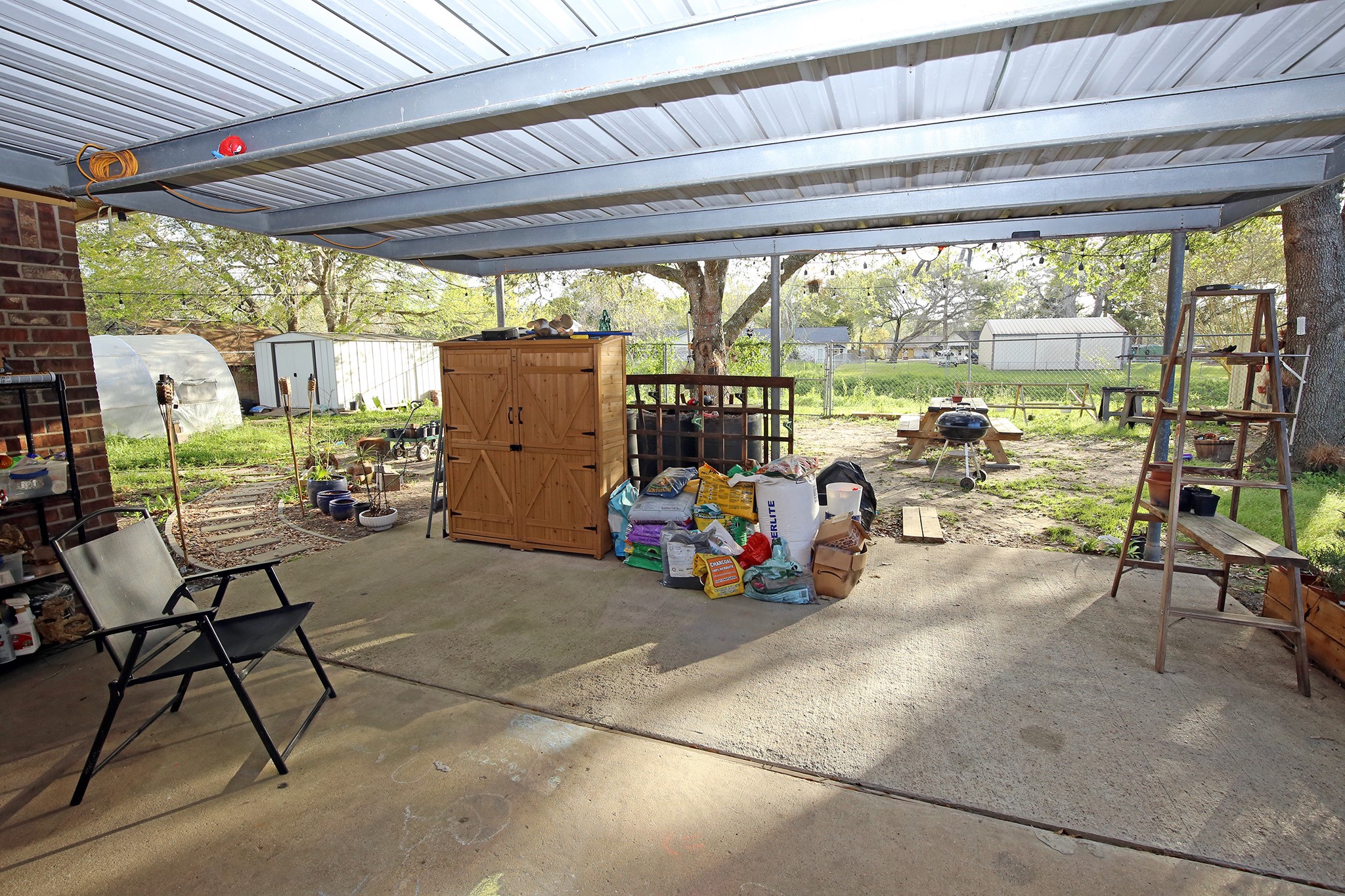 907 Riverside Drive Alvin, TX 77511 - Photo 26 of 31 Let's head outside under the covered porch!