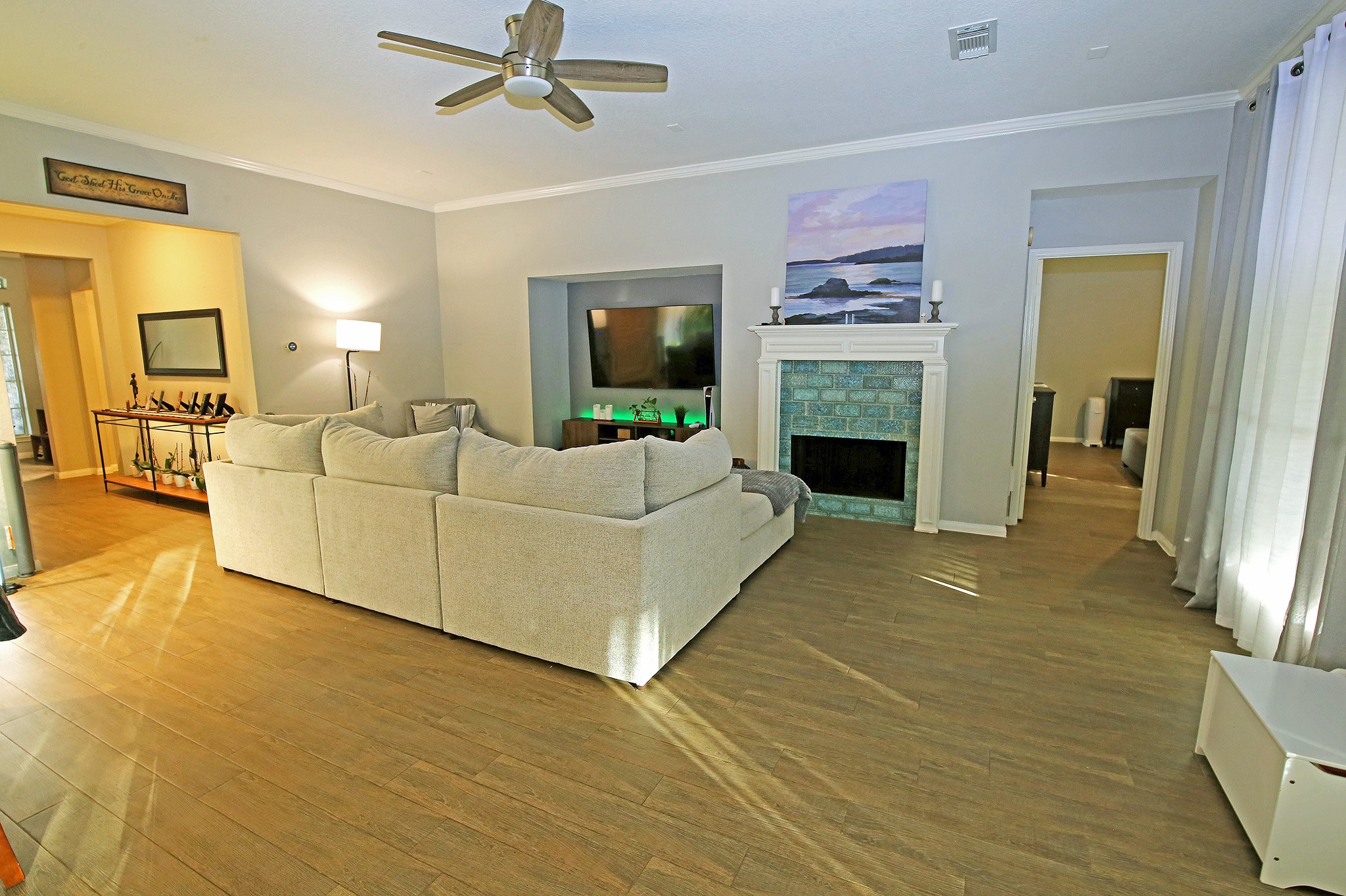 907 Riverside Drive Alvin, TX 77511 - Photo 10 of 31 Living room with the fireplace and the big windows for natural lighting!