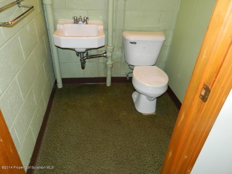 233 East Mountain Road Scranton, PA 18505 - Photo 14 of 26 a bathroom with a sink and a toilet