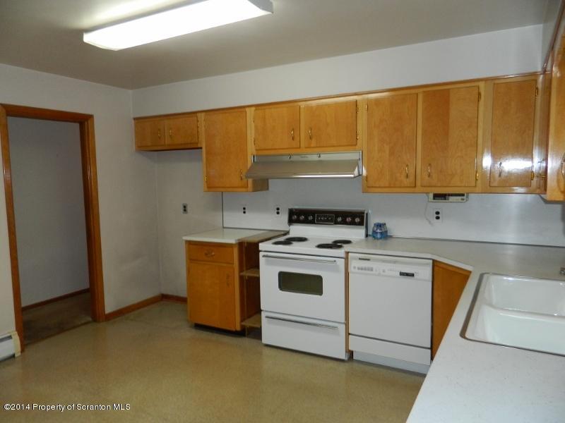 233 East Mountain Road Scranton, PA 18505 - Photo 5 of 26 a kitchen with a stove and a sink