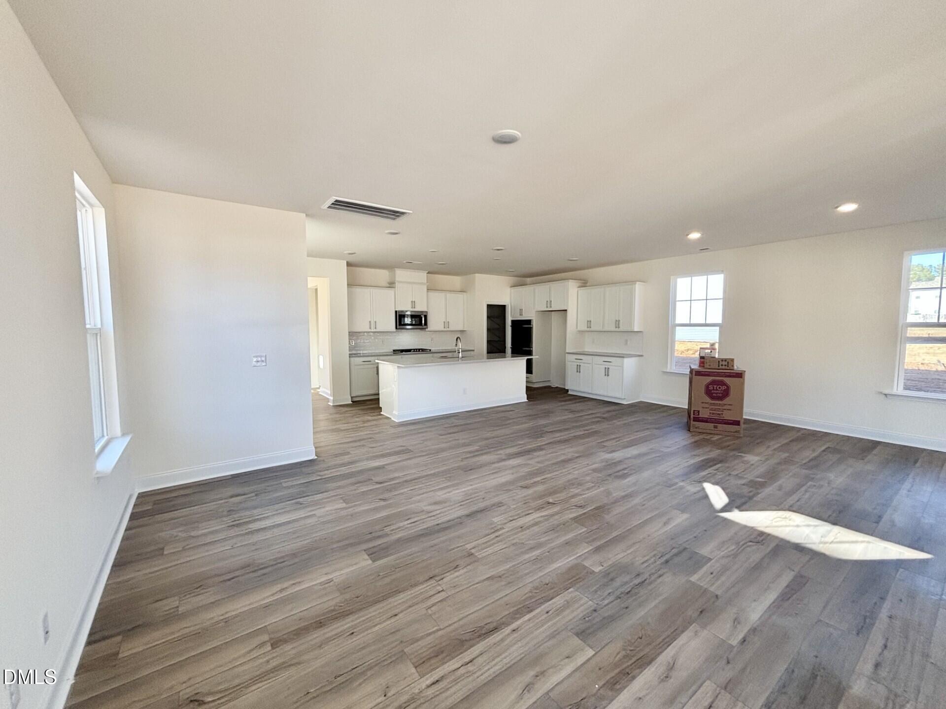 20 Gerrard Street, Unit 6 Franklinton, NC 27525 - Photo 14 of 31 a view of a living room kitchen with furniture and wooden floor