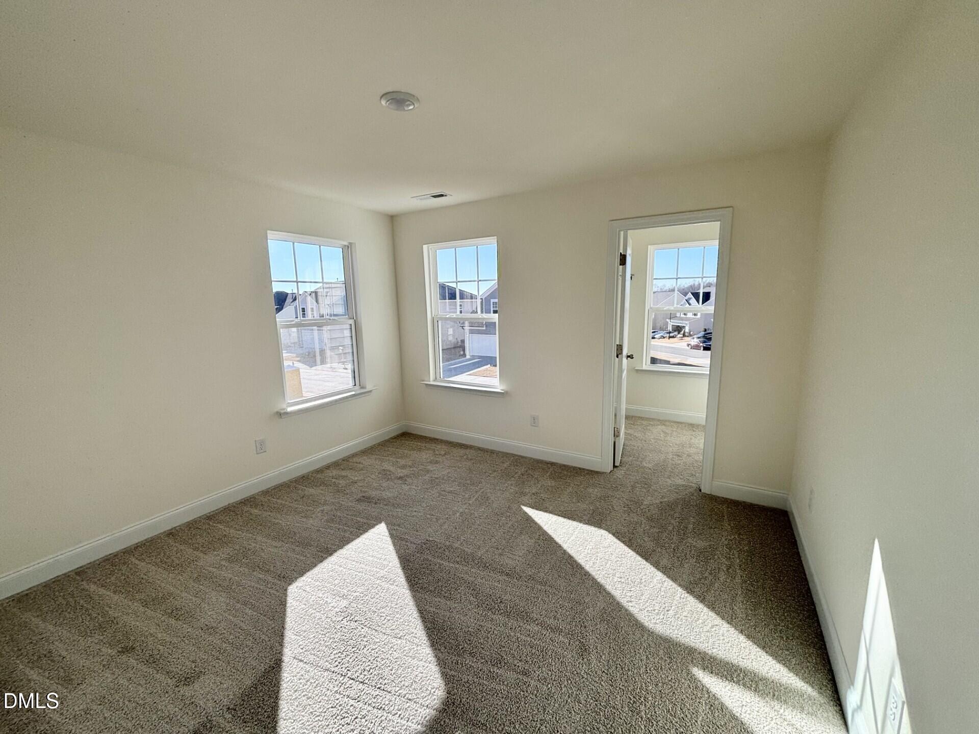 20 Gerrard Street, Unit 6 Franklinton, NC 27525 - Photo 21 of 31 an empty room with windows