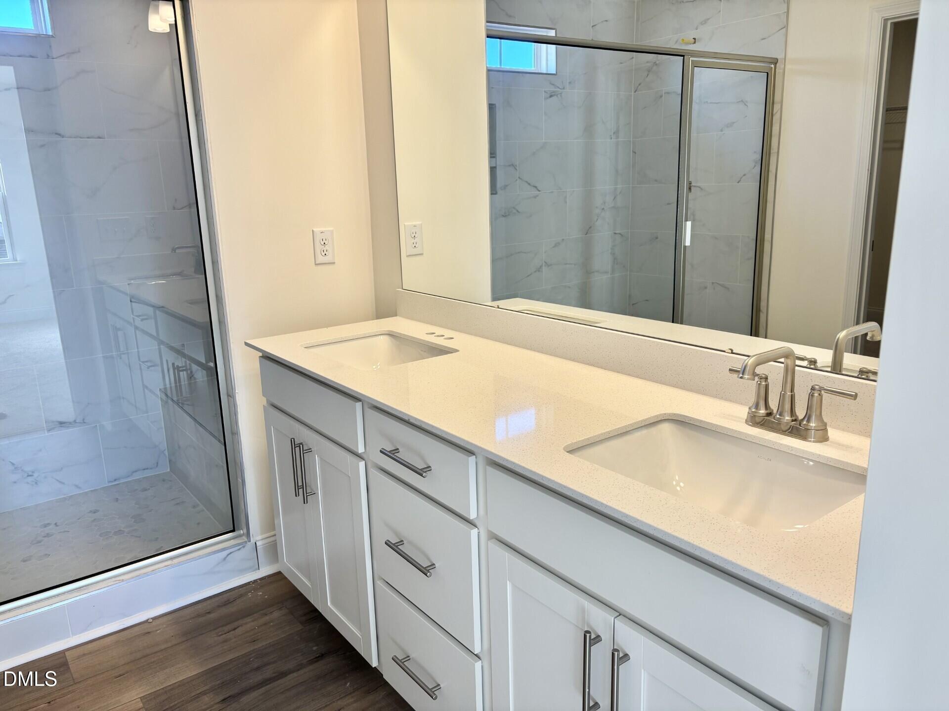 20 Gerrard Street, Unit 6 Franklinton, NC 27525 - Photo 23 of 31 a bathroom with a granite countertop sink and a mirror