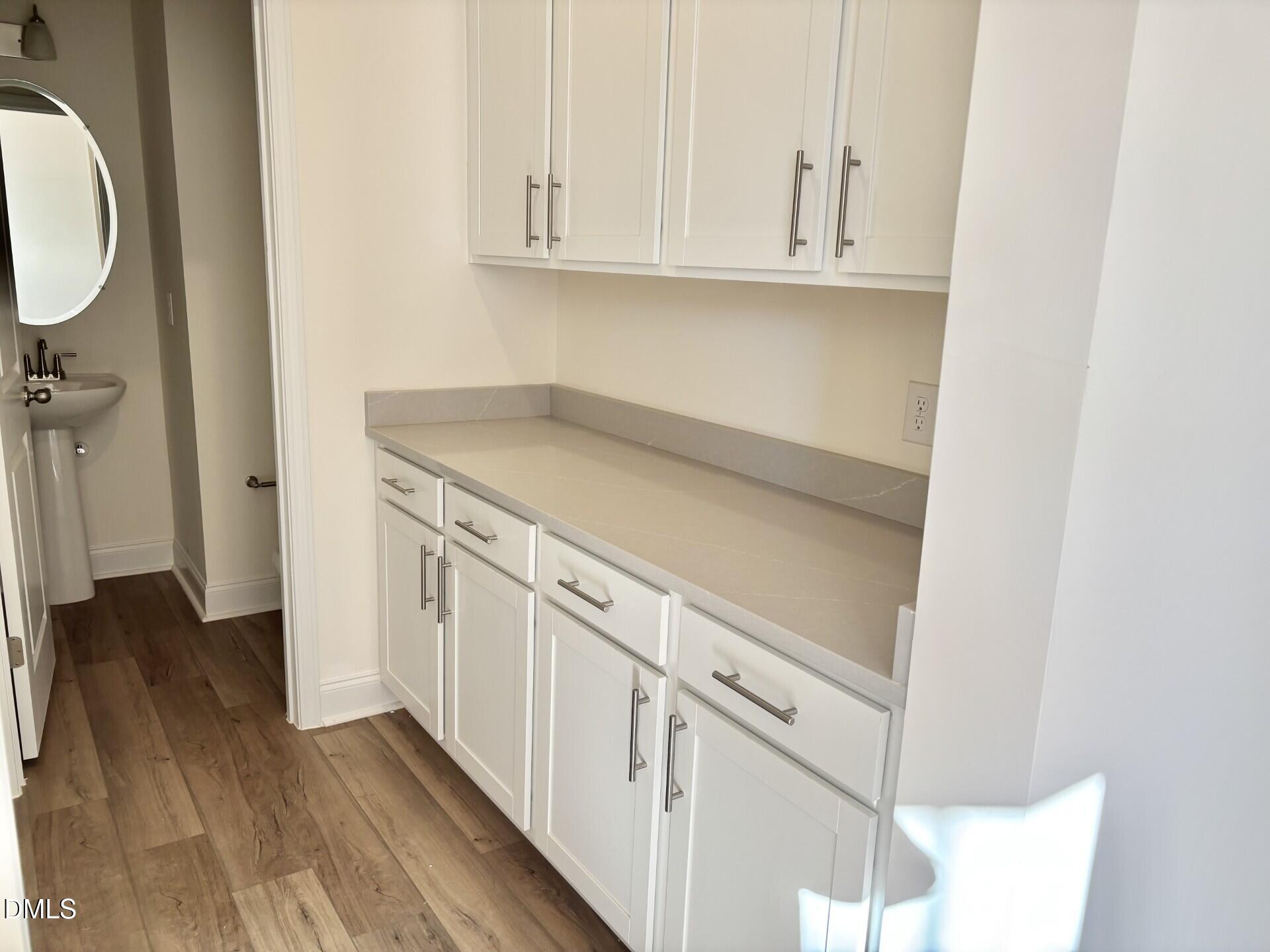 20 Gerrard Street, Unit 6 Franklinton, NC 27525 - Photo 6 of 31 a view of cabinets and wooden floor