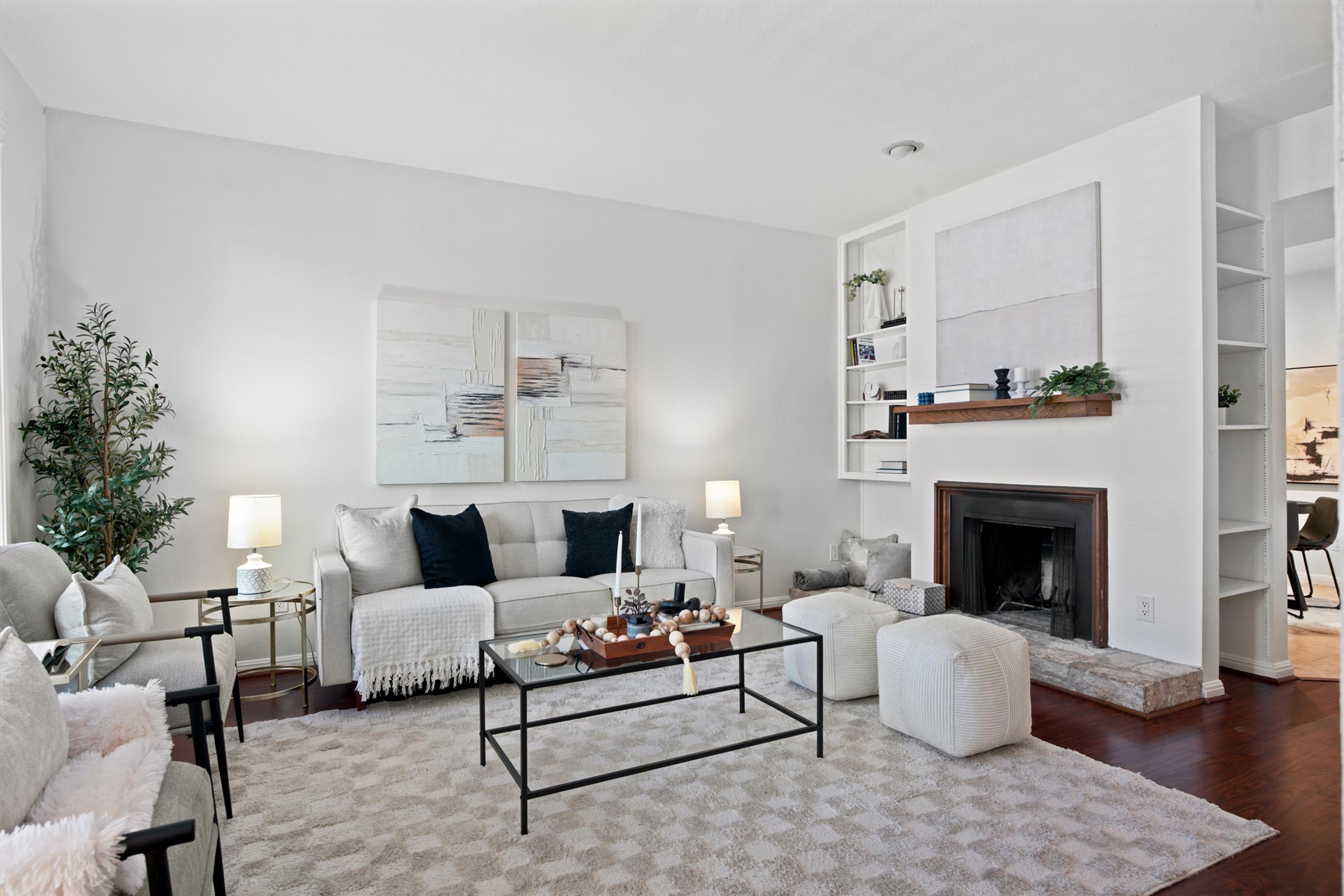 2529 Rio Grande Street, Unit 72 Austin, TX 78705 - Photo 1 of 24 A spacious living room with a wood burning fireplace and built-in shelves.